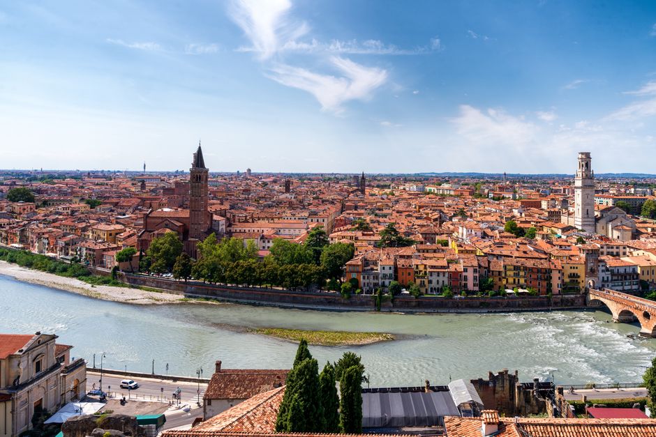 A breathtaking aerial view of Verona, Italy, showcasing historic buildings and the Adige R