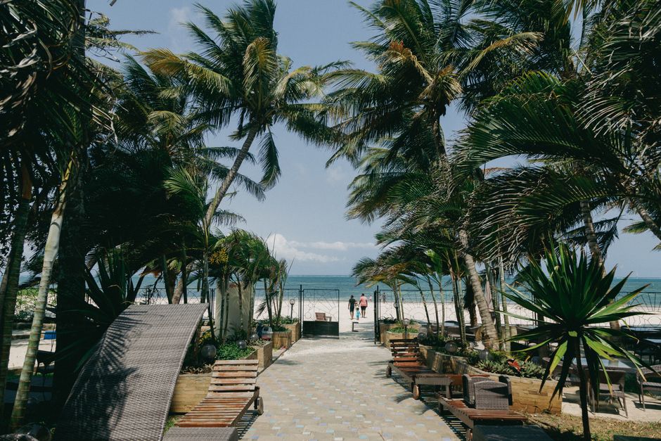 Relax at a tropical beachfront paradise in Mombasa, Kenya.