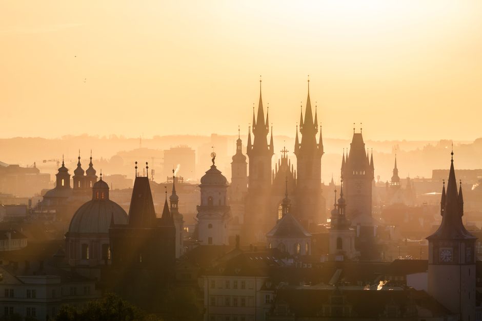 Enchanting silhouette of Prague's iconic spires during golden hour, capturing the city's h