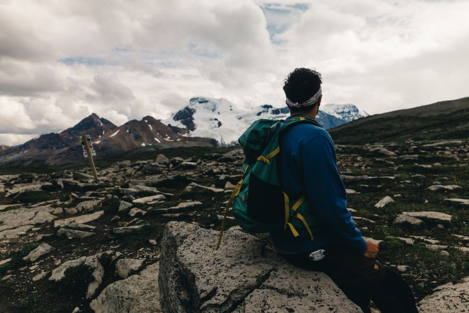 Hiker enjoying mountainous views in Jasper National Park, Alberta.