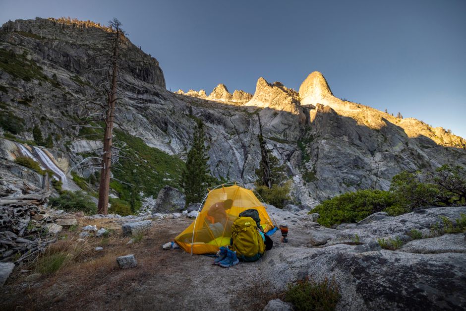 Scenic campsite in Sequoia National Park showcasing mountain peaks at sunrise.