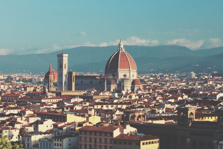 Panoramic view of Florence, Italy featuring the iconic Duomo and historic architecture under a clear sky.